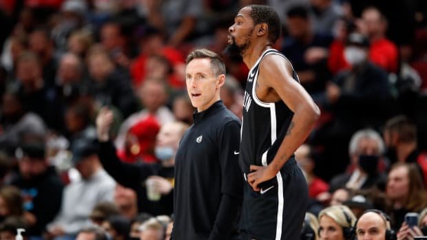 Steve Nash talks with forward Kevin Durant during the first half of an NBA game against the Chicago Bulls.